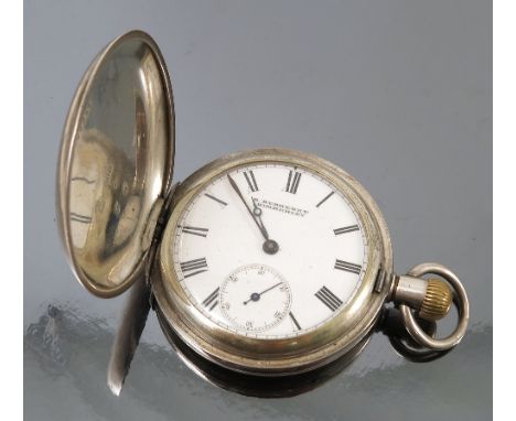 A silver coloured hunter pocket watch, with white enamel dial, signed R Behrendt-Kimberley, with black Roman numerals, hands 