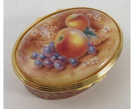 A Royal Worcester oval box, the cover hand painted with fruit by D Fuller, with gilt metal mount, boxed and with certificate 