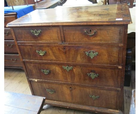 An 18th century walnut chest, fitted two short drawers over three graduated long drawers, with cross banded decoration, af, w