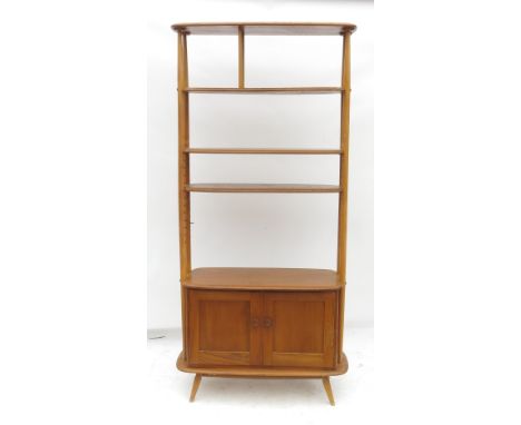 An Ercol display unit, having four open shelves above a cupboard base, width 33ins 