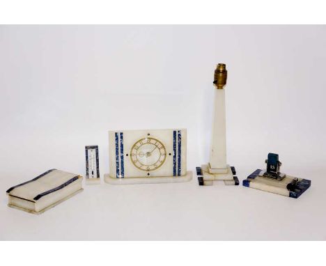 A five piece white onyx and lapis lazuli desk set comprising clock, lamp, cigarette box, thermometer and desk calendar, the c