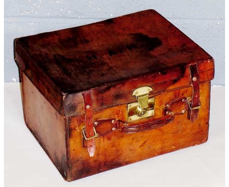 A small leather trunk with brass lock the lid initialled H.A.H, 43 cm wide, 35 cm deep, 28 cm high
