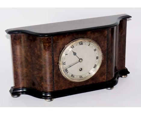An Edwardian burr walnut mantel clock with ebonised cornice and foot, ebonised beaded detail the silvered face with Roman num