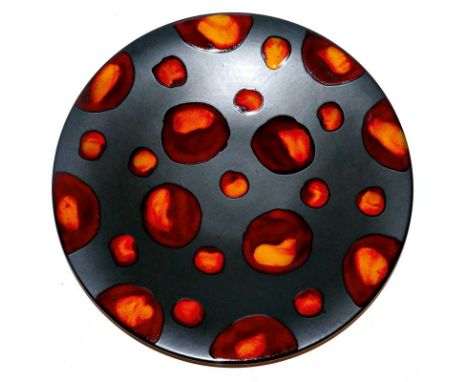 A Poole pottery "living glaze" charger - Galaxy, the matt black glaze with red orange spots, printed mark in black, 41 cm dia