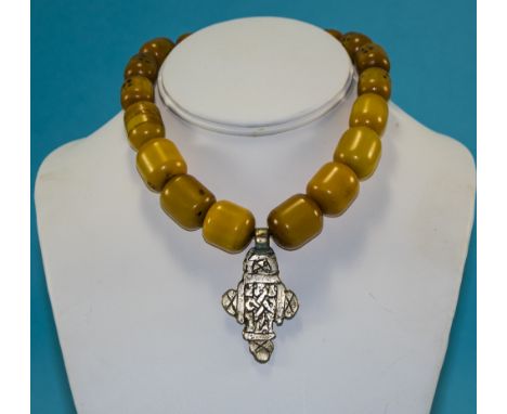 A Vintage Amber Necklace with White Metal Pendant Drop. 14 Inches In Length. 