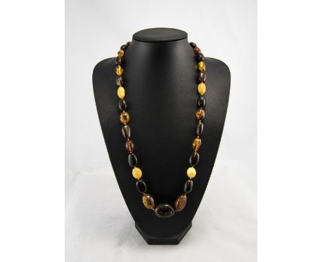 A Vintage Amber Bead Necklace with Gold Coloured Clasp. 30 Inches In Length. 70.7 grams. 