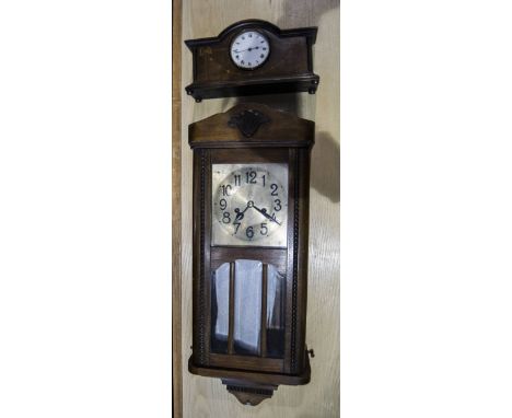 Oak Cased Wall Clock, with Arabic numerals. With weights and pendulum. Height 28 inches. Together with mantle clock, white di