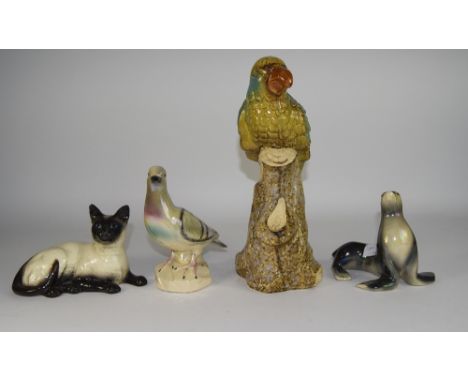 Collection Of Four Decorative Ceramic Figures. Comprising Large Parrot, Small Bird, Sea Lion, Cat.