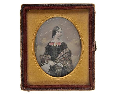*Kilburn (William Edward, 19th century). A ninth-plate daguerreotype of a young lady, circa 1855,  hand-tinted with cloud stu