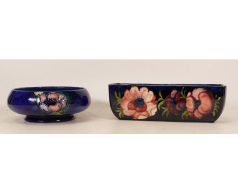 Moorcroft Anemone patterned small rectangular planter together with Anemone footed bowl, both on blue ground (2) 