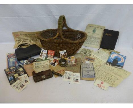 A basket containing a copy of the Evening, Post Office Savings books, Standard dated June 6th 1944, The Women's Land Army mem