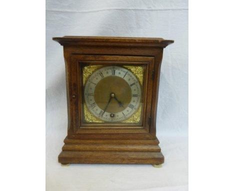 A walnut cased mantle clock stamped W&H Sch to the movement. 
