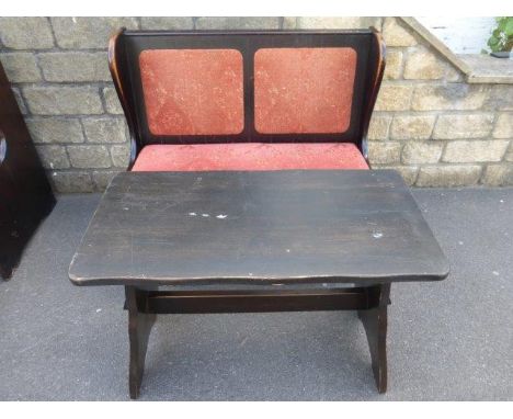 A small two seater wooden settle and side table. 