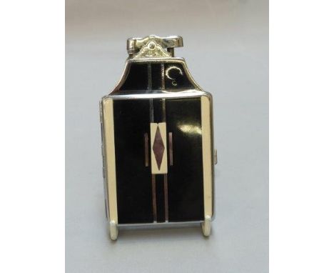 An Art Deco Ronson combined lighter and cigarette case with black and cream enamel panels.
