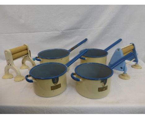 Four unused enamel saucepans and two tabletop mangles. 