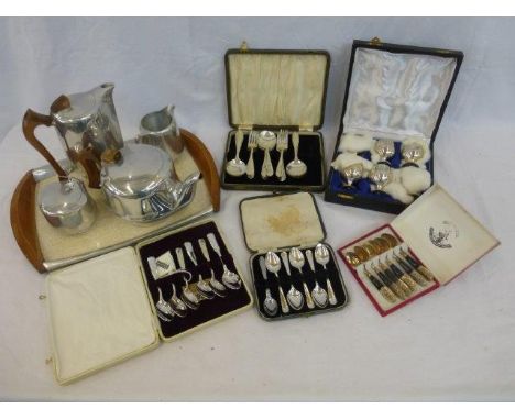 A five piece Picquot ware tea set and an assortment of boxed flatware. 