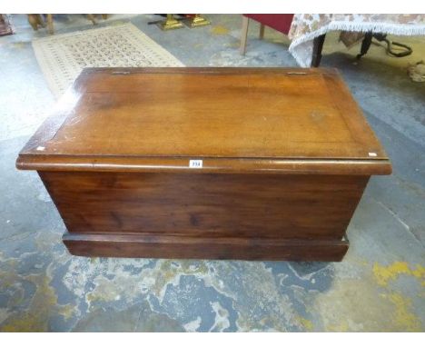 A late 19th Century twin handled trunk with porcelain castors. 