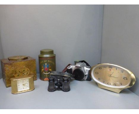 Two tin tea caddies, a Canon EOS500 camera, a Five Ramo clock, a pair of theatre binoculars and a Swiza Coquet tambour fronte