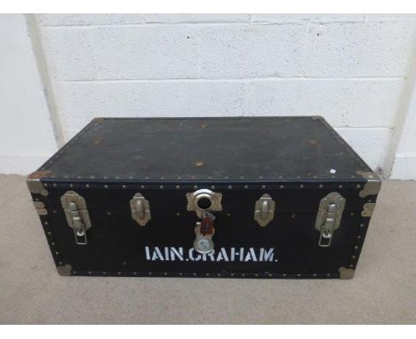 A contemporary twin handled travel trunk. 