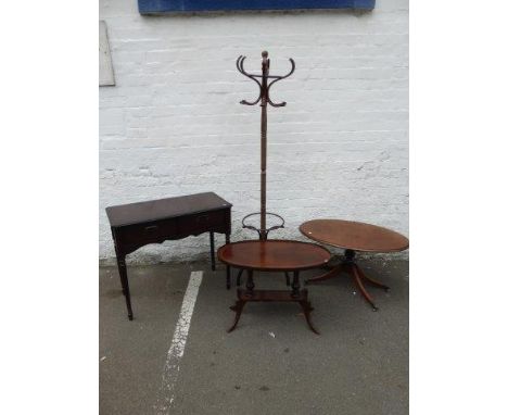 Two mahogany oval topped occasional tables, a two drawer side table and a revolving coat stand. 