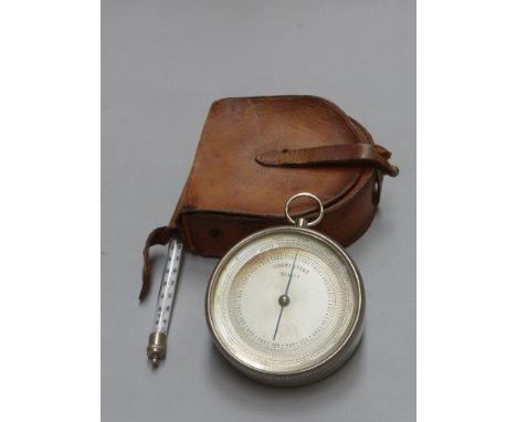 A leather cased pocket barometer no. 1570, marked to the dial 'compensirt' complete with a pull-out thermometer.
