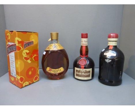 A bottle of Dimple Old Blended Scotch Whisky, a bottle of Drambuie The Cream Liqueur, a bottle of Cointreau and a bottle of G