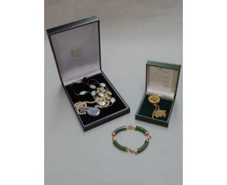 A jade bangle, a silver pendant necklace etc. 