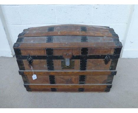 A 19th Century wooden slatted and leather clad dome topped trunk. 