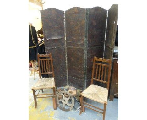 A pair of unusual Arts and Crafts oak and rush seated bedroom chairs, a tooled leather four fold screen and a box of hand too