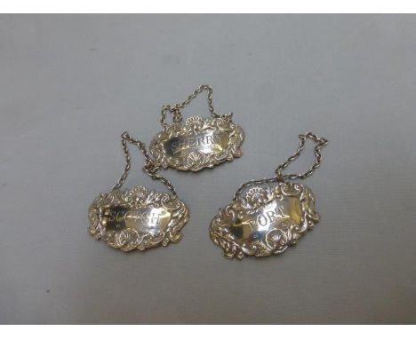 Three silver drinks labels: Port, Scotch and Sherry, maker R & K, London 1970.