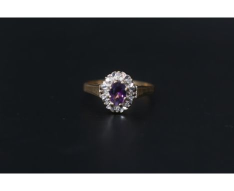 Ladies 9ct Gold Amethyst and Diamond Oval Cluster ring Size P. 1.8g total weight 