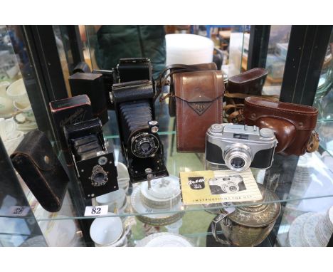 Arette IA camera with case, and 2 Kodak cased cameras