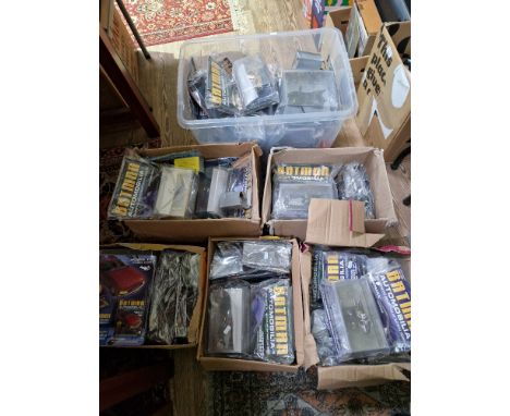 A large collection of Batman automobilia model vehicles, boxed with magazines (un-opened).  