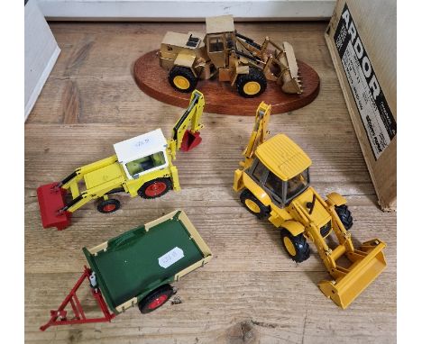 Four model JCB diggers/trailer comprising one presentation model on plinth, one by NZG, another by DA and a trailer.  