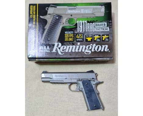 A Remington 1911RAC silver tactical .177mm calibre Co2 air pistol, serial no.18713848, 22cm long, in original box with manual