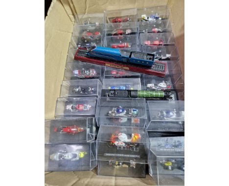 A box of approximately 60 Deagostini model motorcycles. 