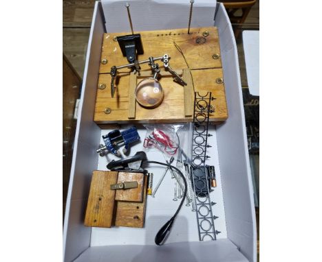 A box of model making tools and equipment including clamps, clips, screwdrivers, magnifying glass, etc. 