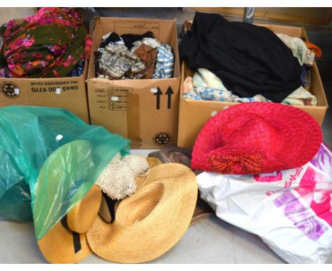 A large quantity of vintage textiles and clothing to include various silk fabrics, vintage dresses and a quantity of vintage 