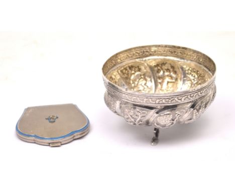 A Continental silver bowl with embossed decoration and raised on three outstretched supports styled as fish, unmarked, diamet