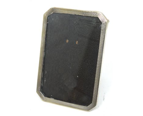 A George V hallmarked silver engine turned photograph frame, Birmingham 1928.