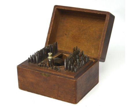 An early 20th century watchmaker's staking press and tools.