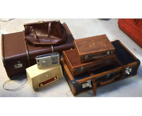 Four vintage suitcases to include two small leather examples, a vintage doctor's style bag and two radios to include a retro 