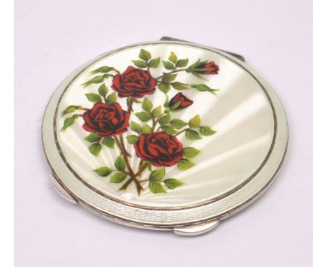 An Elizabeth II hallmarked silver and enamel rose-decorated compact, Mappin & Webb, Birmingham 1961, diameter 9cm, in origina