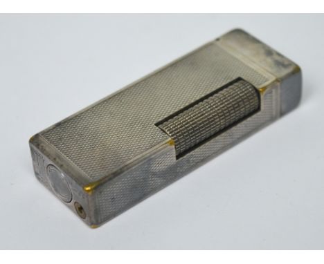 A boxed Dunhill lighter with original instruction booklet.