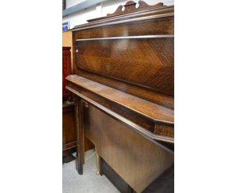 A large Edwardian oak fire surround with top shelf supported by curved brackets, height 167cm.