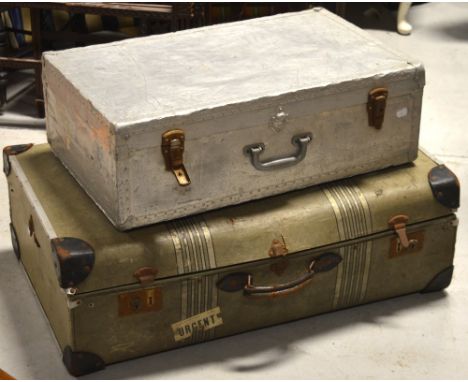 Two vintage trunks largest bearing remnants of luggage labels, width 84cm, the smaller being a white metal mounted trunk, wid