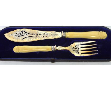 A cased Victorian hallmarked silver fish slice and fork with ivory handles, Sheffield 1878. CONDITION REPORT Crack to handle 