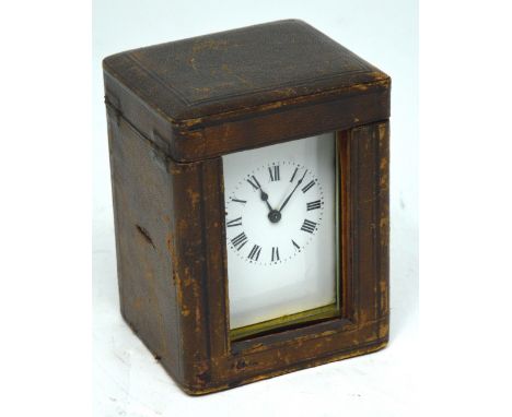 A French brass carriage clock, the dial set with Roman numerals, height 11cm, in original fitted box with key.