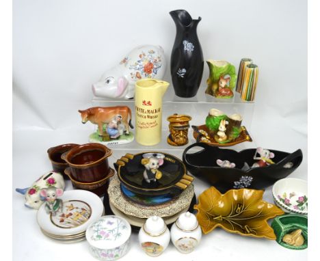 A collectors' lot of decorative 20th century ceramics to include money banks, Wade Scotch whisky jug, Guinness ashtray etc.