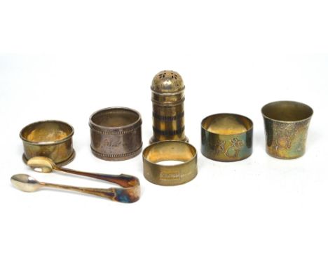 A quantity of silver to include a hallmarked silver pepper pot, a sterling silver napkin ring, a hallmarked silver napkin rin